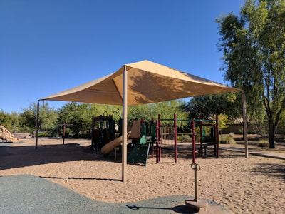Playground shade sail for a school or park play area